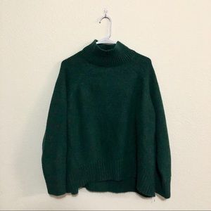green turtleneck sweater